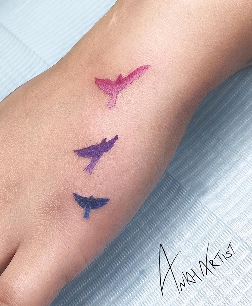 Water Colored Bird Hand Tattoo