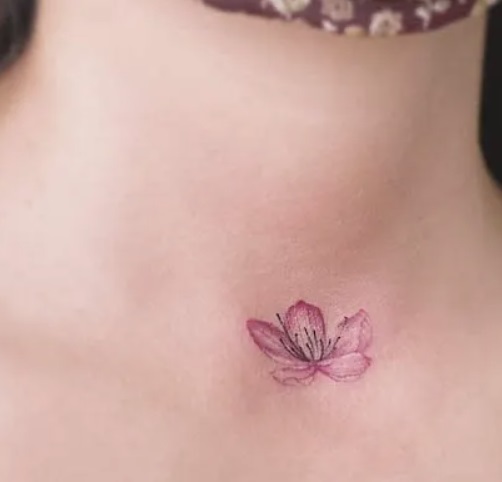 small Flower Front Neck Tattoo  